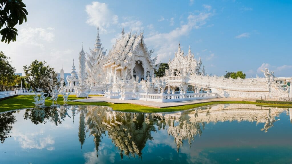 White Temple Chiang Rai Thailand with reflection in the water Wat Rong Khun Northern Thailand