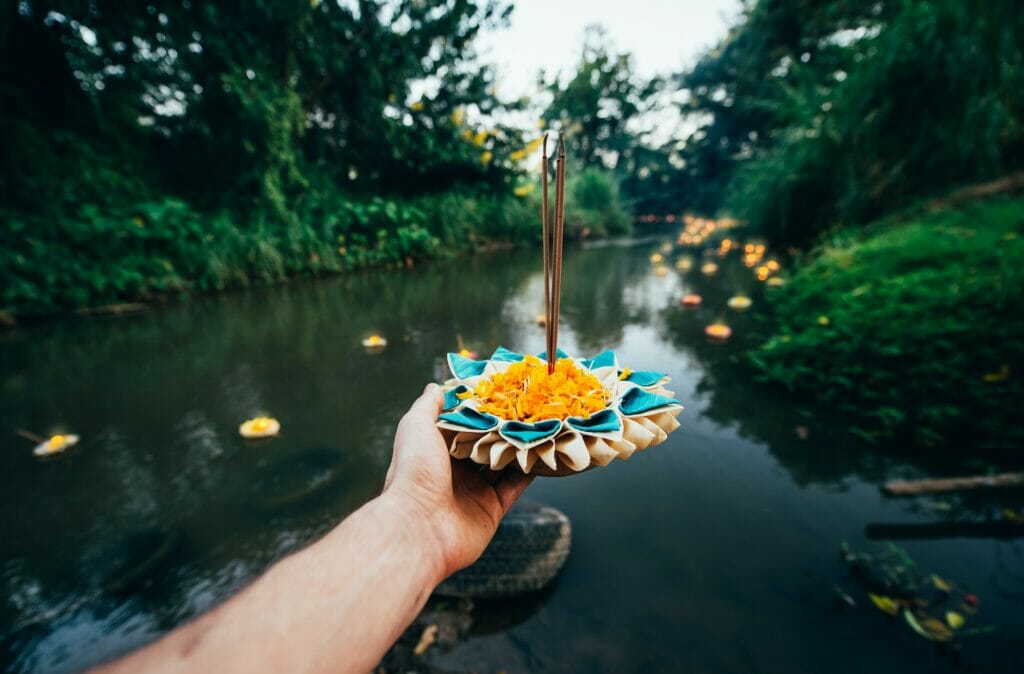 Loy krathong festival, thai new year party with floating buckets release in the river